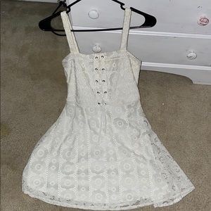 woman’s white lace mini dress